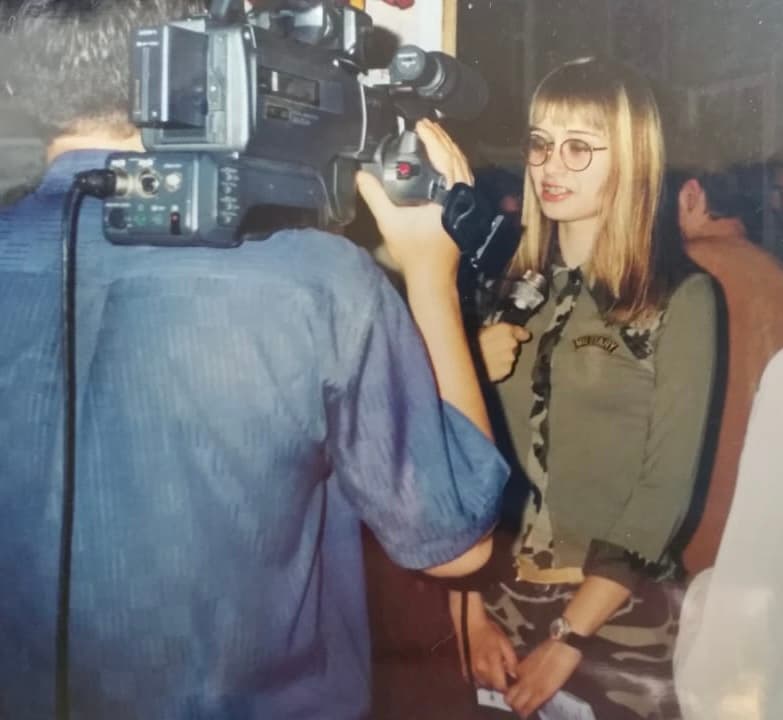 Victoria being interviewed at her personal art exhibition